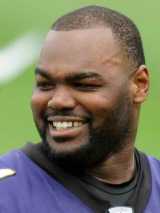 Michael Oher mentoring young football players.