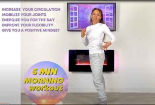 A fitness instructor demonstrates a 5-minute Cozy Cardio morning workout routine, embracing the "Cozy Cardio" trend.