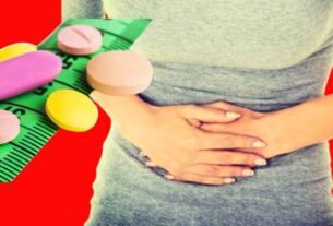 Woman in pain holding stomach next to weight loss drugs.