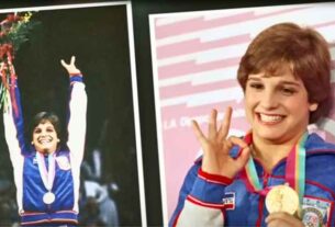 Mary Lou Retton proudly displaying her Olympic gold medal