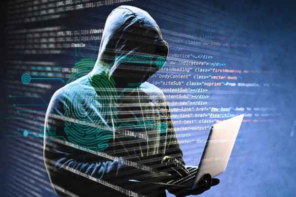 A cybercriminal wearing a mask and hood, highlighting the secrecy of "The Dark Web.