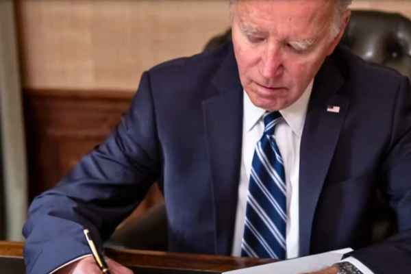 President Biden signing the bipartisan shutdown bill.