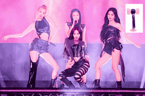 BLACKPINK members performing on stage with inset photo of BLACKPINK Lightstick