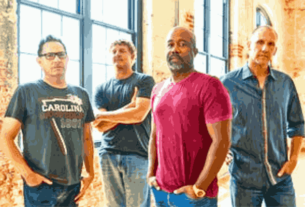 Hootie and the Blowfish members posing for the Summer Camps with Trucks Tour 2024.