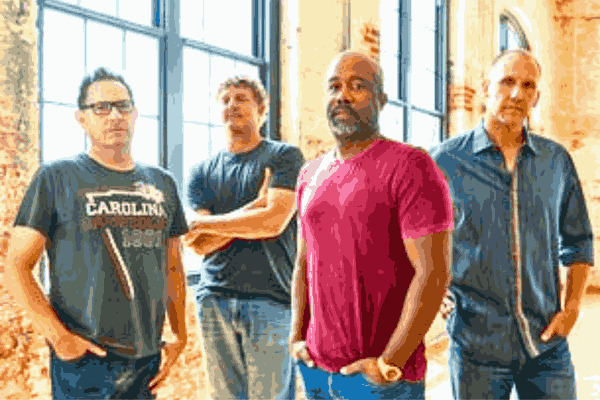 Hootie and the Blowfish members posing for the Summer Camps with Trucks Tour 2024.