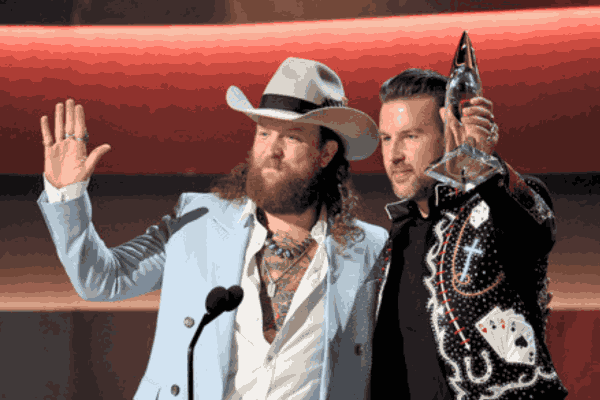 The dynamic Brothers Osborne celebrate their triumph at CMA Awards 2023, grasping the prestigious Vocal Duo of the Year award with infectious energy.