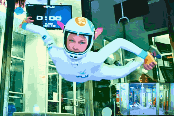 Expert Indoor Skydiver soaring through the air - Focus Keyphrase: Indoor Skydiving