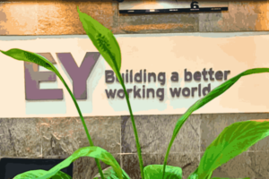 EY Layoffs: EY logo displayed on office building