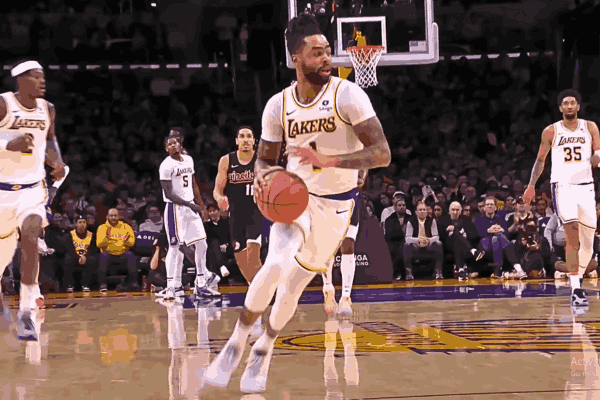 D'Angelo Russell takes charge in the Lakers vs Blazers clash, showcasing skill and determination on the basketball court.