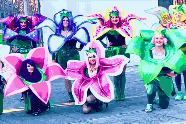 Several participants in the carnival dressed in the iconic Mardi Gras Outfits, showcasing a variety of colors and designs.