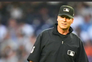 Angel Hernandez officiating a Major League Baseball game, marking his retirement after over three decades in the sport.