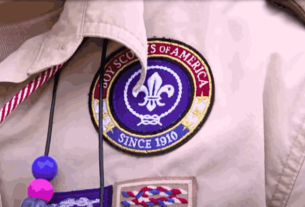 Scouting America logo on a flag, representing the rebranding of the Boy Scouts of America to embrace inclusivity and diversity."