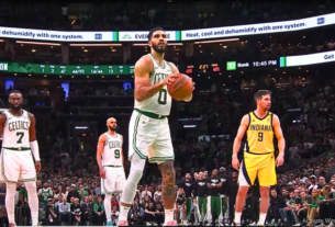 Celtics vs Pacers Game 1 action with Jayson Tatum making a crucial shot in overtime.