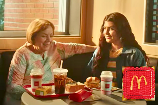 A heartwarming scene of a grandmother and granddaughter sitting at a table filled with McDonald's treats, including the Grandma McFlurry.