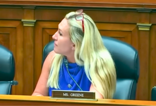 Marjorie Greene speaking passionately during a Congressional hearing.