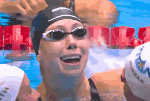 Gretchen Walsh celebrates after breaking the 100-meter butterfly world record.