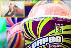 People enjoying Free Slurpee Day at a 7-Eleven store, holding free Slurpees and smiling.