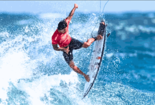 Gabriel Medina performing a stunning barrel ride at Teahupo'o during the 2024 Olympics, earning a remarkable 9.90 score.