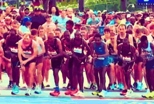 Participants running in the Peachtree Road Race, Atlanta's premier Fourth of July event with 50,000 attendees.