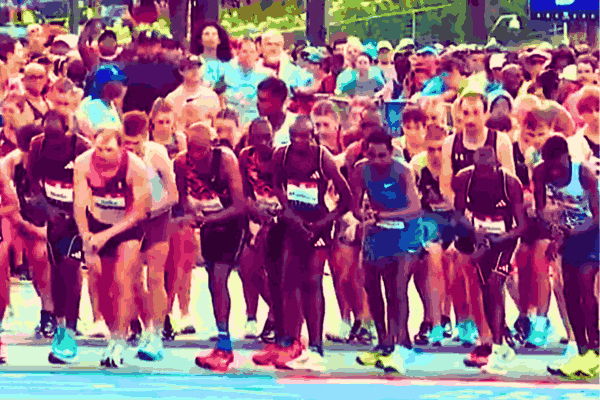 Participants running in the Peachtree Road Race, Atlanta's premier Fourth of July event with 50,000 attendees.