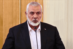 Ismail Haniyeh, a senior Hamas leader, speaking at an event before his assassination in Tehran, which escalated tensions in the Middle East.