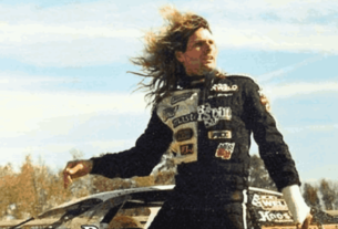 Scott Bloomquist, legendary dirt track racer, in his racecar on the track, showcasing his passion and legacy in motorsports.