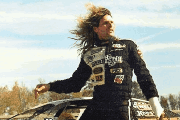 Scott Bloomquist, legendary dirt track racer, in his racecar on the track, showcasing his passion and legacy in motorsports.