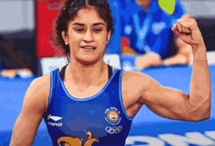 Vinesh Phogat celebrates after defeating Yui Susaki in the 2024 Olympic opener, showcasing her resilience and tactical brilliance.