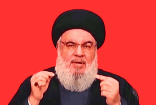 Image of Hezbollah leader Hassan Nasrallah delivering a speech, targeted by an Israeli airstrike amid rising tensions in the Middle East.
