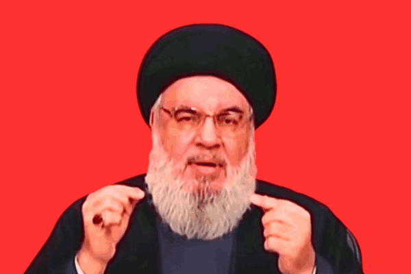 Image of Hezbollah leader Hassan Nasrallah delivering a speech, targeted by an Israeli airstrike amid rising tensions in the Middle East.