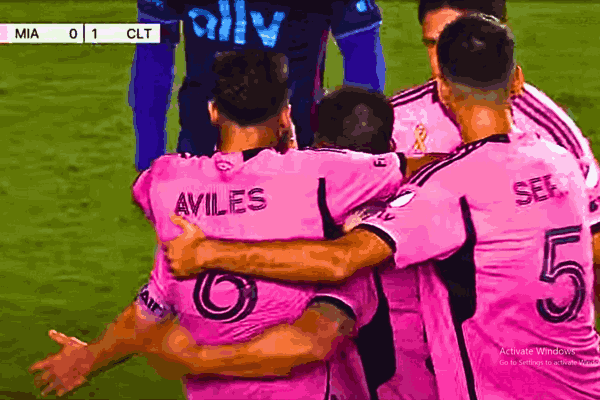 Lionel Messi celebrates after scoring an equalizer during the Inter Miami - Charlotte FC match, with teammates surrounding him in a thrilling 1-1 MLS draw.