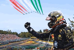 Charles Leclerc celebrates his victory at the Italian GP, standing on the podium at Monza with Ferrari fans cheering in the background.