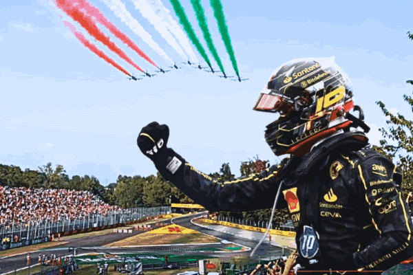 Charles Leclerc celebrates his victory at the Italian GP, standing on the podium at Monza with Ferrari fans cheering in the background.