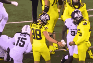 Michigan vs Oregon game action highlighting Oregon Ducks' 31-10 victory over Michigan State Spartans, with a powerful running game led by Jordan James.
