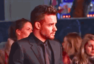 ONE DIRECTION Liam Payne at a public event, smiling in front of fans before his tragic passing.