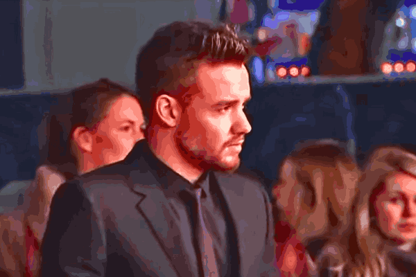 ONE DIRECTION Liam Payne at a public event, smiling in front of fans before his tragic passing.