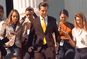 Gaetz standing at a podium during a press conference, symbolizing his controversial nomination as Attorney General.