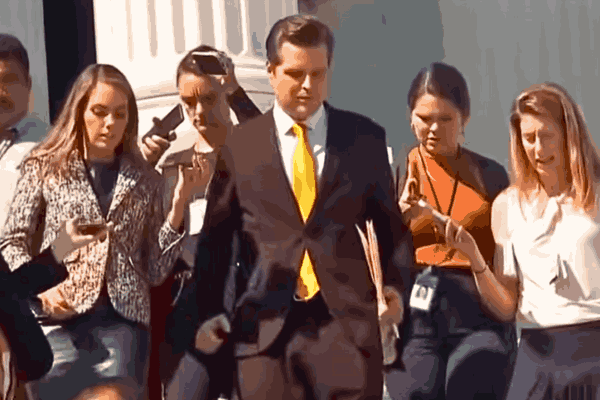 Gaetz standing at a podium during a press conference, symbolizing his controversial nomination as Attorney General.