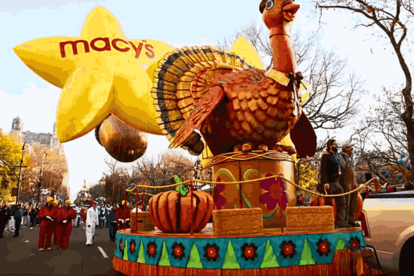A vibrant scene from the Macy's Parade featuring iconic balloons and floats parading through Manhattan during the 2024 Thanksgiving celebration.