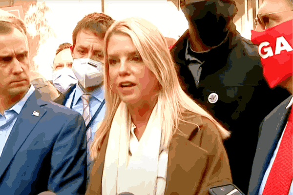 Pam Bondi speaking at a press conference, showcasing her expertise as Trump’s nominee for Attorney General and former Florida Attorney General.