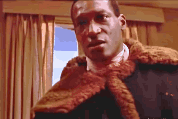 Tony Todd, iconic Candyman star, in a memorable scene showcasing his commanding presence and powerful portrayal in horror cinema.
