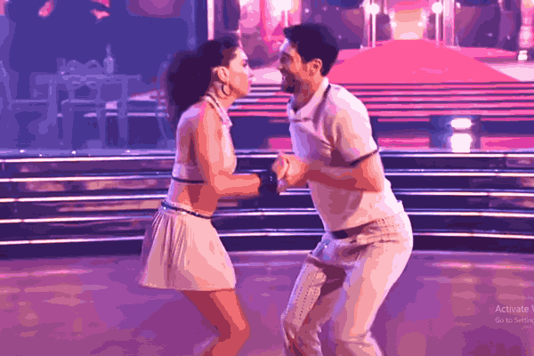 Joey Graziadei and Jenna Johnson celebrate their historic win at the DWTS Finale, holding the Len Goodman Mirrorball Trophy on the dazzling stage.