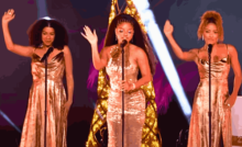 A vibrant stage performance featuring legendary artists celebrating Motown Christmas with iconic songs and festive spirit.