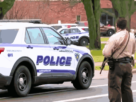 Police vehicles outside Abundant Life Christian School after the Wisconsin school shooting, with officers responding to the tragic incident.